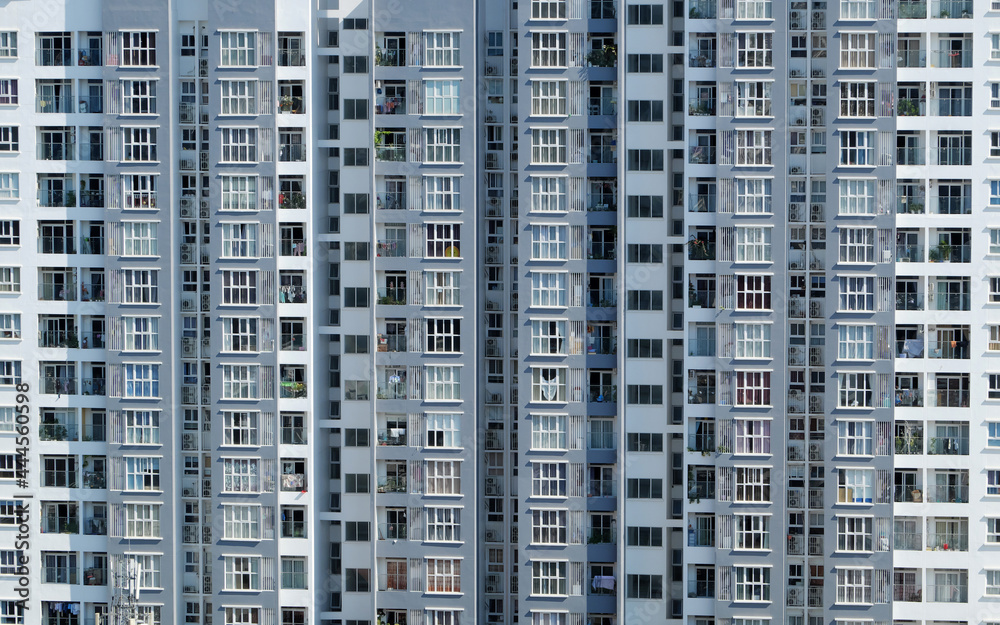 Amazing front of high rise building with many apartment house facade in straght view