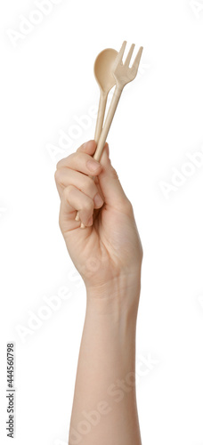 Woman holding eco friendly cutlery on white background, closeup. Conscious consumption