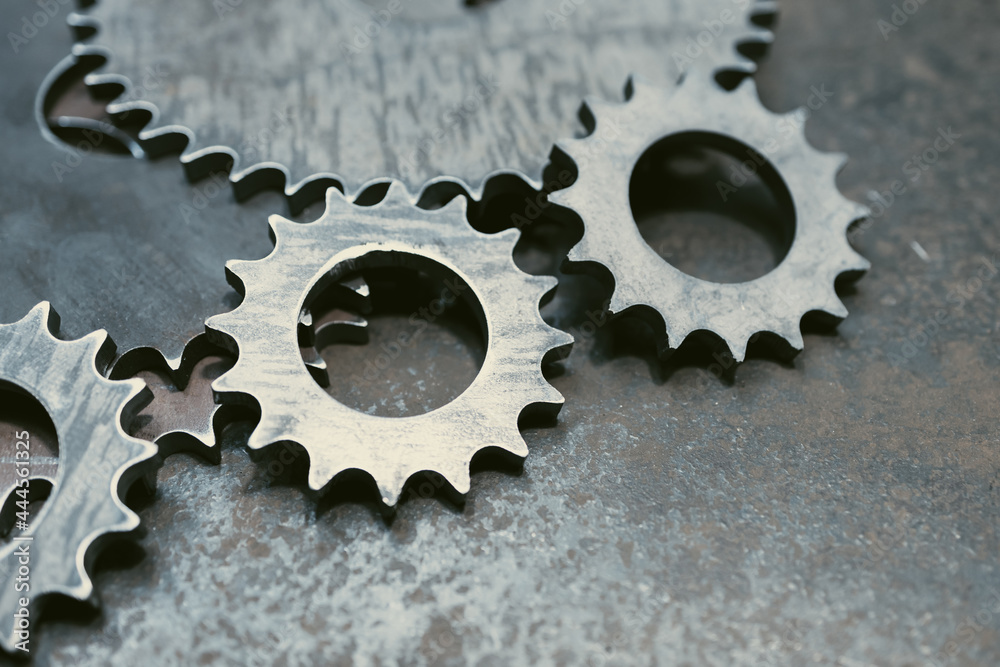 steel gray gears on steel surface, steel scratched surface steel gray gears on steel surface, steel scratched surface