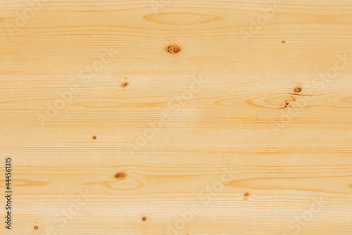 Pine wood table top varnished in transparent color to highlight the beauty of its knots and veins.