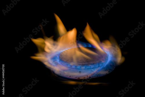 Flame of a gas burner on a black background photo
