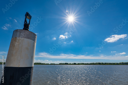 Glückstadt, Germany. The river Elbe with fairway buoy. photo