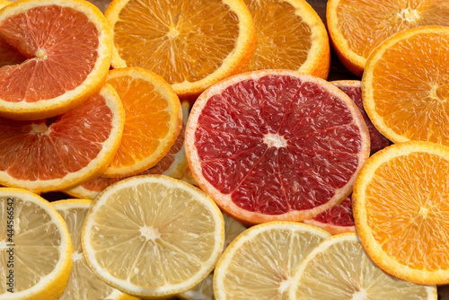 Many kind orange cara cara , lemon, star ruby grape , navel put on wooden tray nature background for gift and good healthy.
