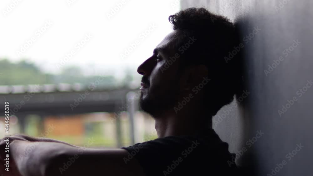 Sad man sitting outdoor, Domestic violence, family problems, Stress, violence, The concept of depression, and suicide.looking up, praying prayer, thinking. Portrait, closeup, 4K UHD.