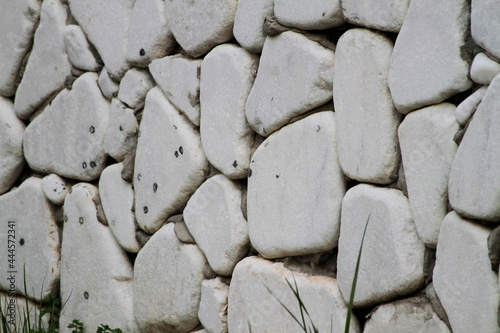 Wall cladding made using white, rounded white stones