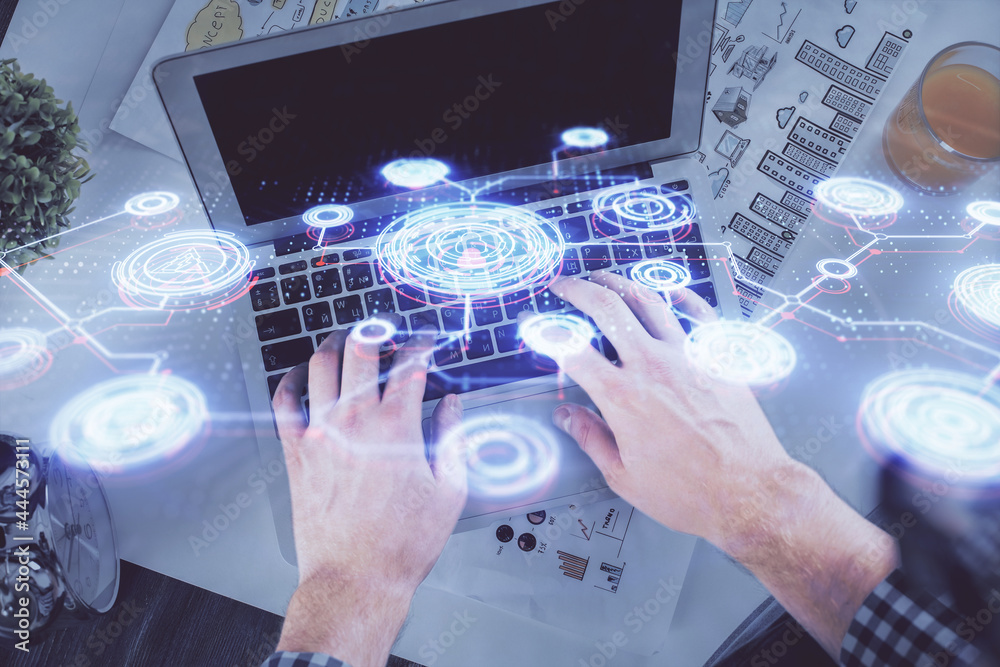 Double exposure of man's hands typing over computer keyboard and social network theme hologram drawing. Top view. People connection web concept. Double exposure of man's hands typing over computer keyboard and social network theme hologram drawing. Top view. People connection web concept.