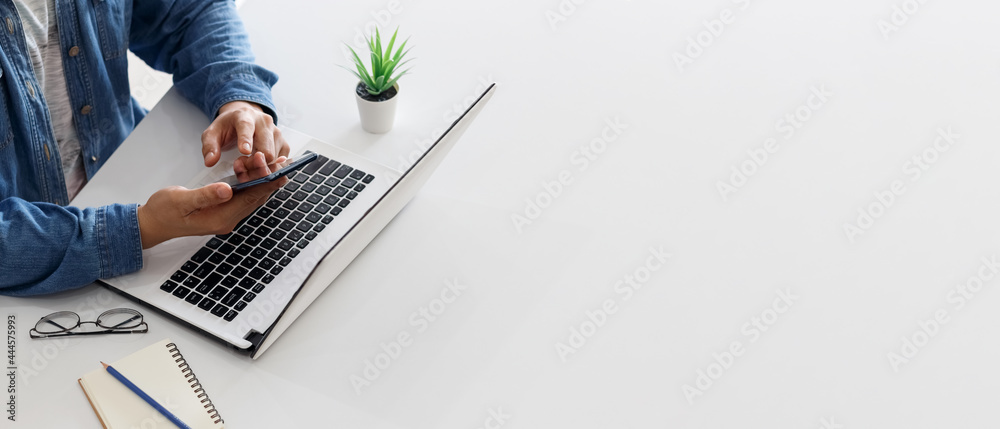 Banner of laptop and young man hands with copy space in white color background. - obrazy, fototapety, plakaty 