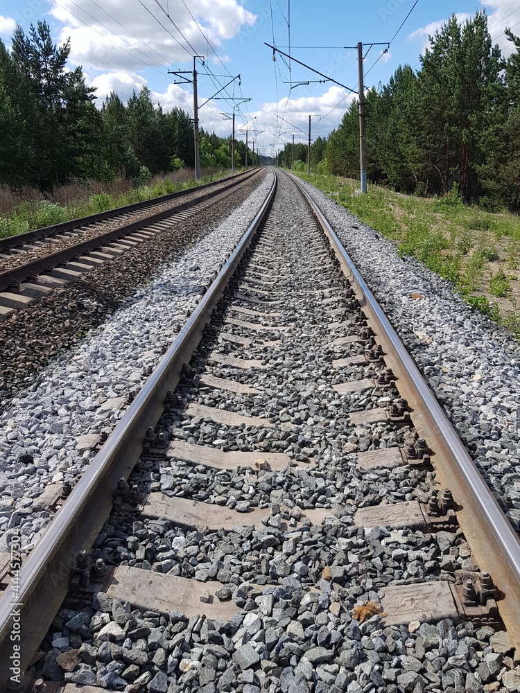 Railroad tracks go to the horizon