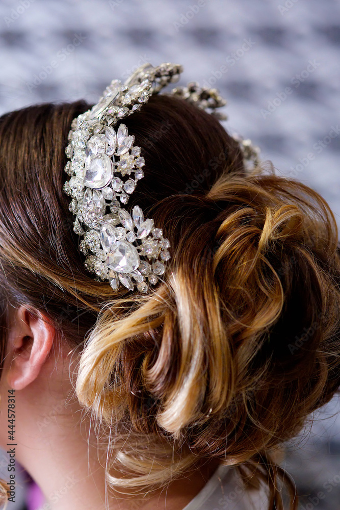 A luxurious tiara for a bride or princess close-up. Jewelry accessories A luxurious tiara for a bride or princess close-up. Jewelry accessories