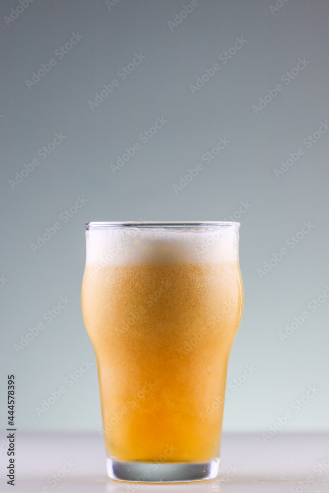Craft beer with foam forming in the glass Craft beer with foam forming in the glass