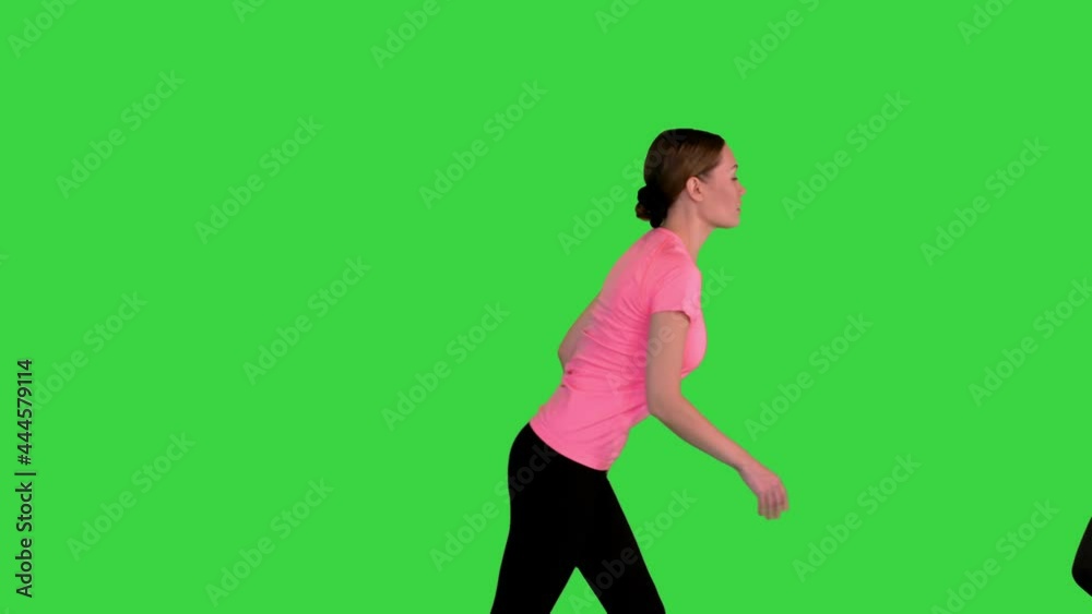 Many different people walking and running from side to side on a Green Screen, Chroma Key. Many different people walking and running from side to side on a Green Screen, Chroma Key.