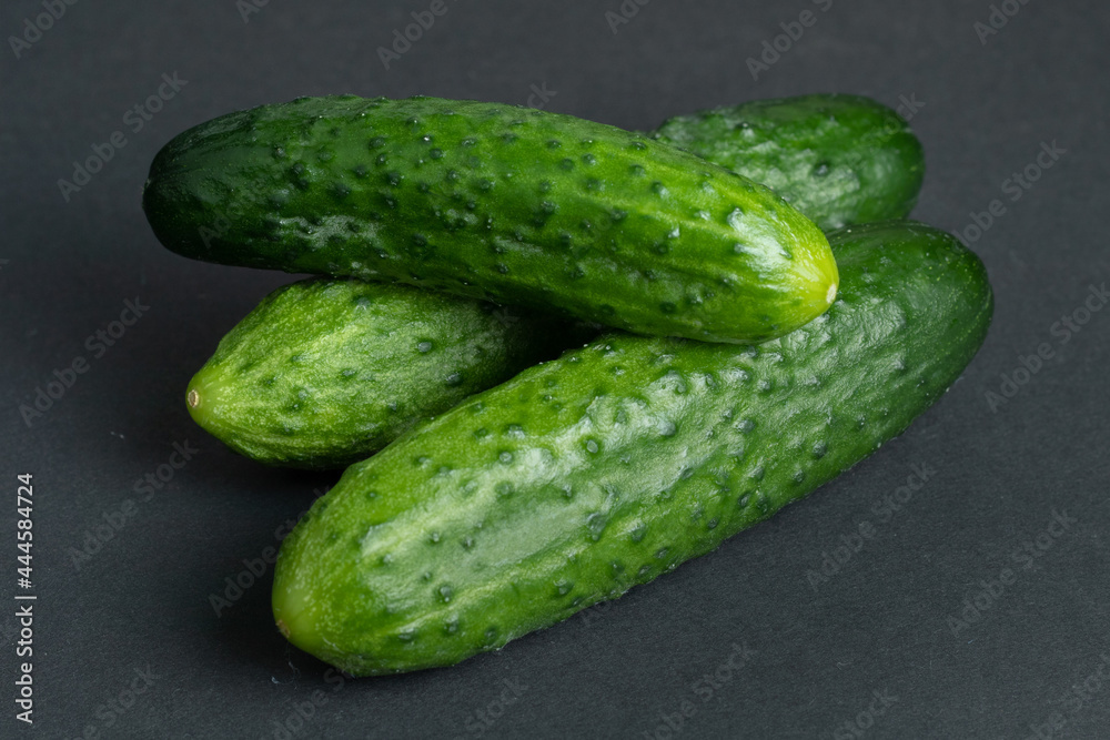 Fresh cucumbers on dark background Fresh cucumbers on dark background