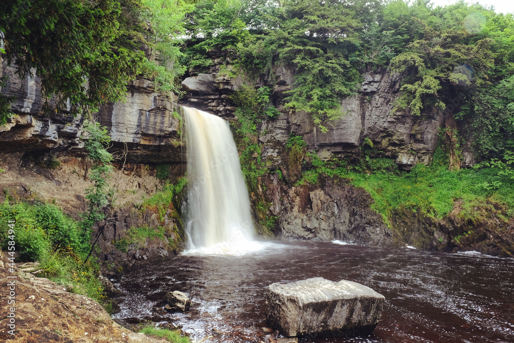 Obraz premium A view of Thornton Force waterfall on the Ingleton Trail, in the Yorkshire Dales, North Yorkshire.