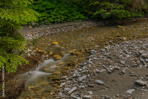 Nice color clean creek near Huttschag village in summer hot day photo