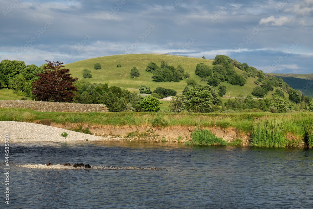 A view along the River Wharfe towards Kail Hill, in the Yorkshire Dales, North Yorkshire. A view along the River Wharfe towards Kail Hill, in the Yorkshire Dales, North Yorkshire.