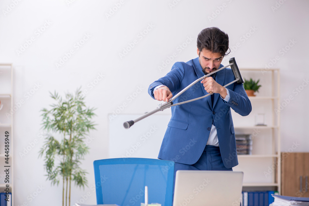 Young male employee after accident at workplace Young male employee after accident at workplace