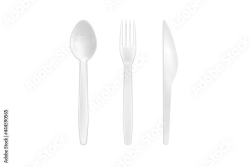 White plastic spoon, fork and knife isolated on white background. Close up of disposable tableware. 