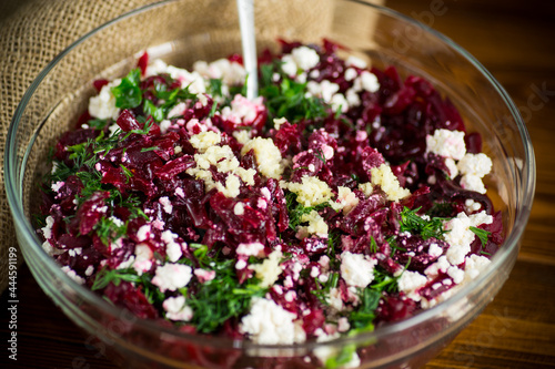 dietary salad of boiled beets with walnuts and cottage cheese