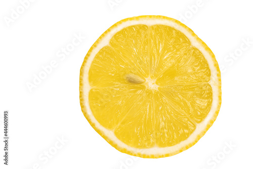 Juicy yellow textured lemon slice close-up on white isolated