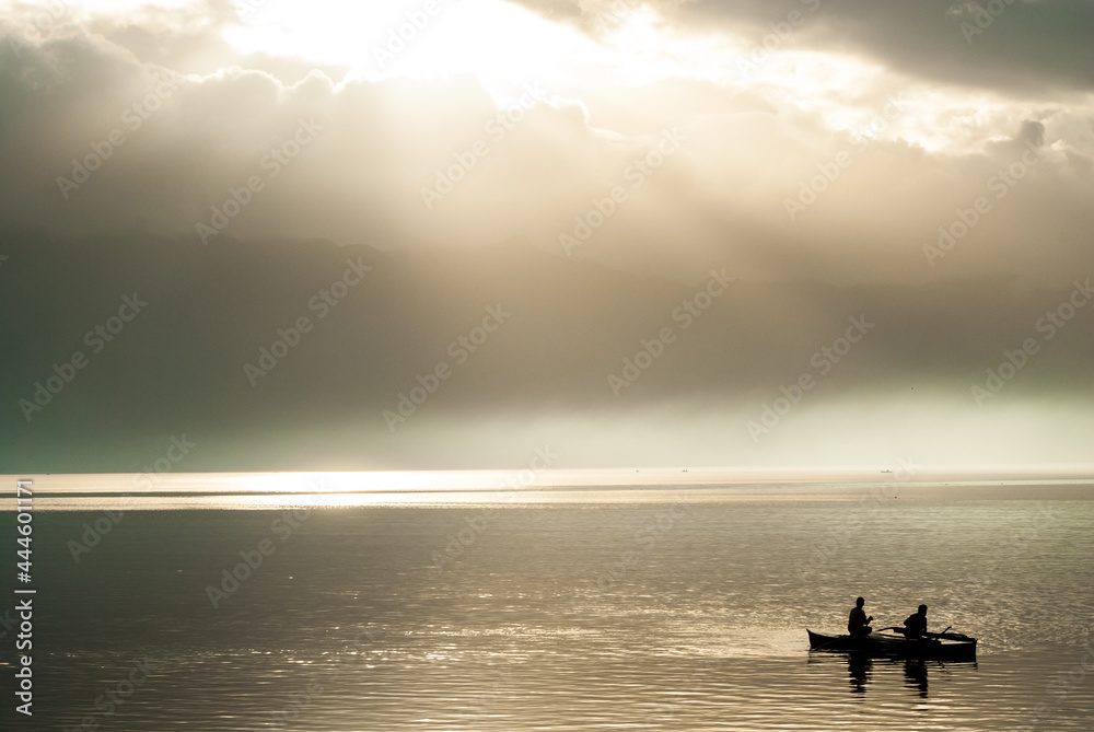 silhouette of a couple on a boat