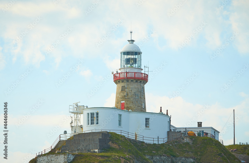 A look on famous landmark lighthouse and Dublin bay on a cloudy sunny day from Howth Head Summit.