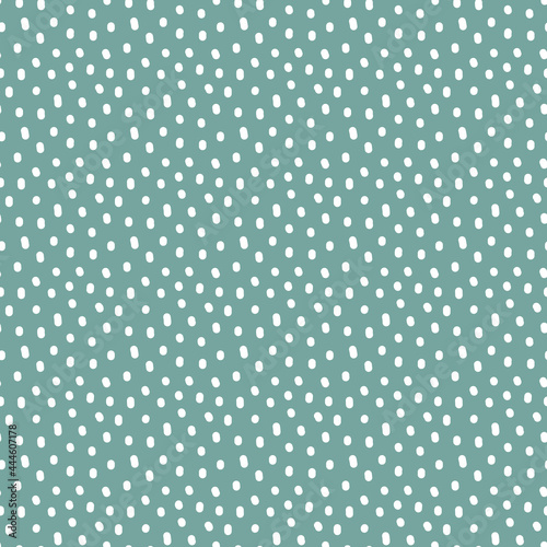 Vintage Polka Dot seamless pattern. White irregular spots, scattered various shape specks on green background. Abstract vector texture for nursery print design, fashion textile, fabric, scrapbooking