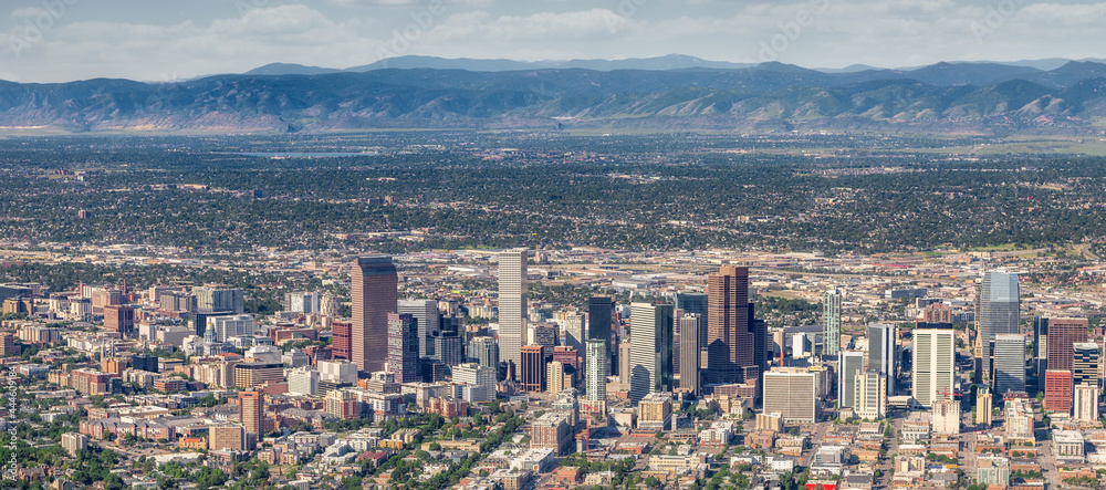 Skyline of Denver Colorado seen from above with the Rocky Mountains