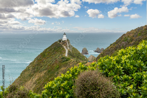 Famous landscape and lighthouse at Nugget Point, New Zealand photo