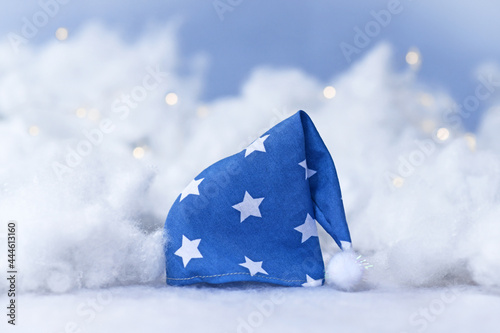 Blue nightcap with stars surrounded by clouds and stars photo