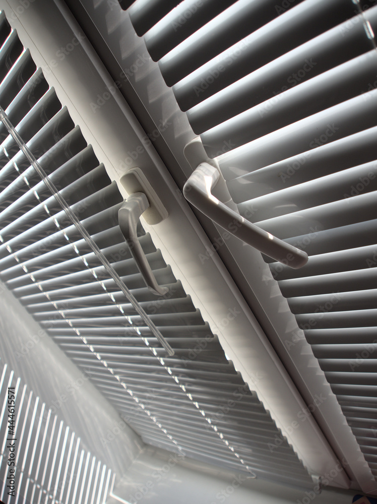 Obraz premium covered white blinds on the window