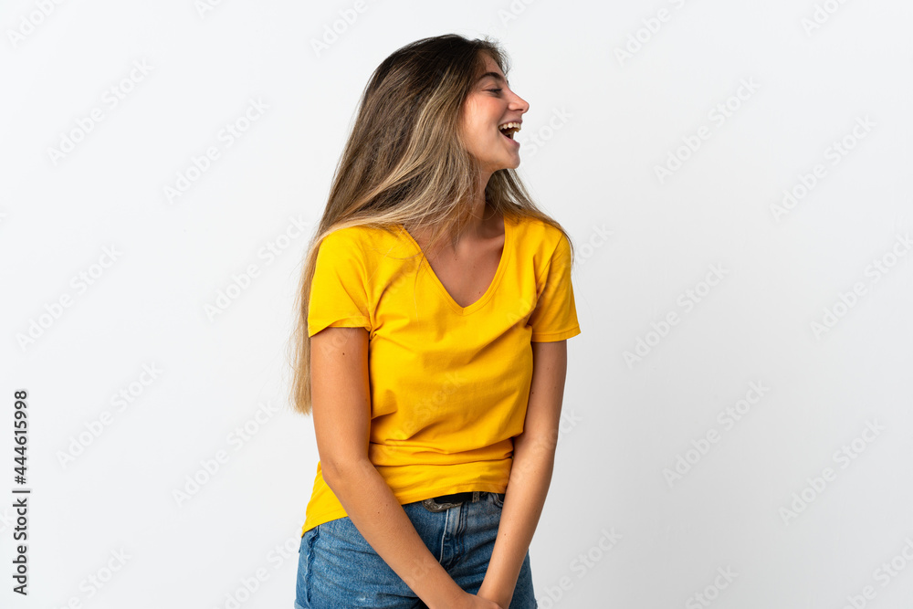 Young caucasian woman isolated on white background laughing in lateral position Young caucasian woman isolated on white background laughing in lateral position