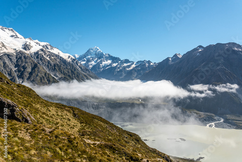 Cloudy view to the valley of Mount Cook National Park from Mueller Hut Route, New Zealand