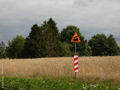 Rural landscape with railway crossing sign, Pomorskie province, Poland