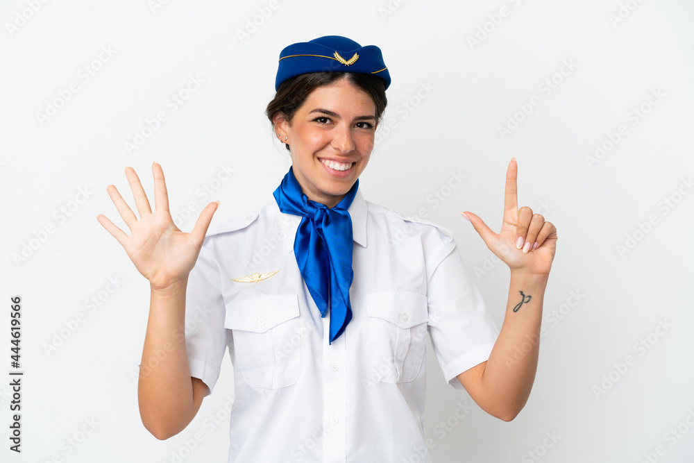 Airplane stewardess caucasian woman isolated on white background counting seven with fingers