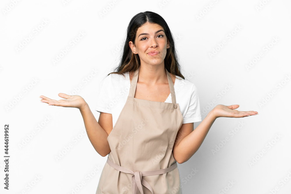 Restaurant waiter over isolated white background having doubts while raising hands Restaurant waiter over isolated white background having doubts while raising hands
