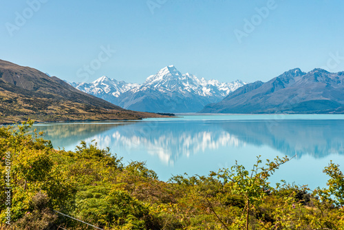 Scenic reflection of Mount Sefton and Mount Cook at lake Pukaki, New Zealand