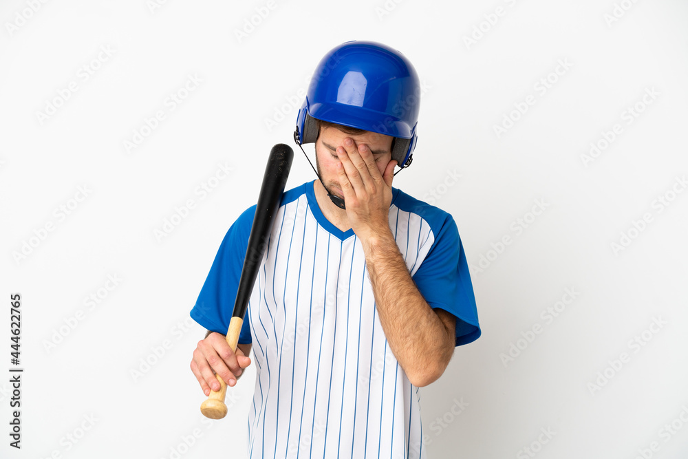Young caucasian man playing baseball isolated on white background with tired and sick expression