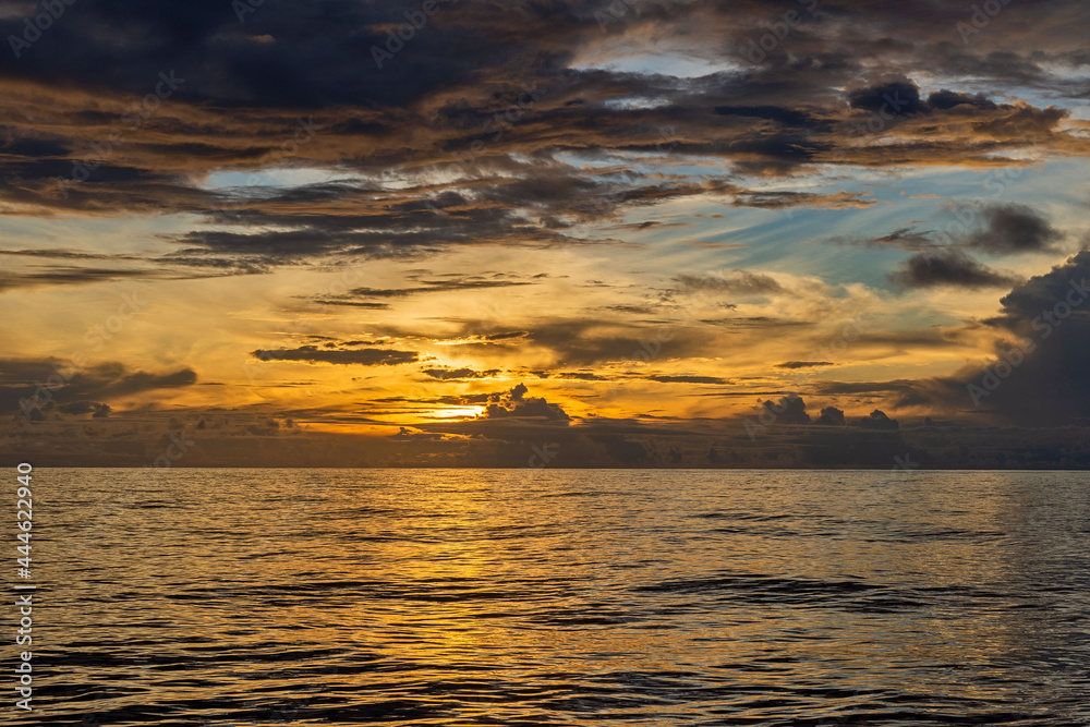 Fototapeta premium Beautiful seascape - waves and sky with clouds with beautiful lighting. Golden hour. 