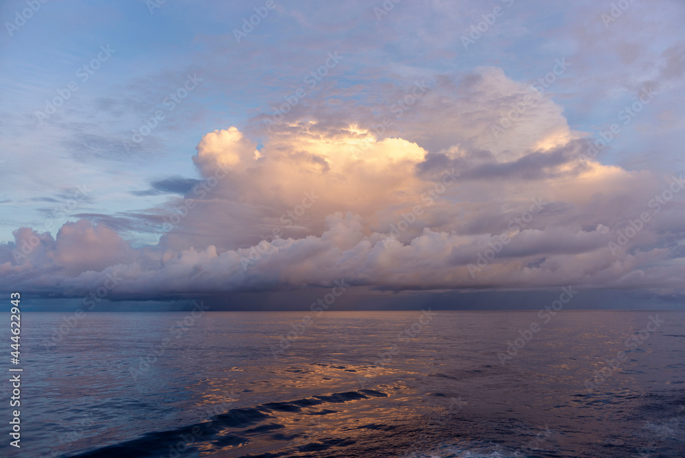 Seascape, blue sea. Calm weather with clouds. View from vessel. 