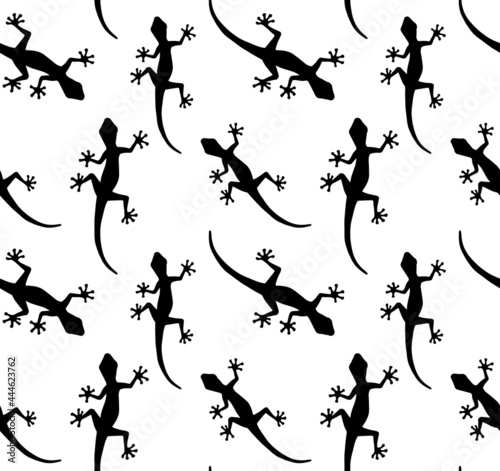 Vector seamless pattern of hand drawn lizard silhouette isolated on white background