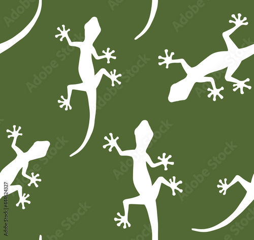 Vector seamless pattern of white hand drawn lizard silhouette isolated on green background