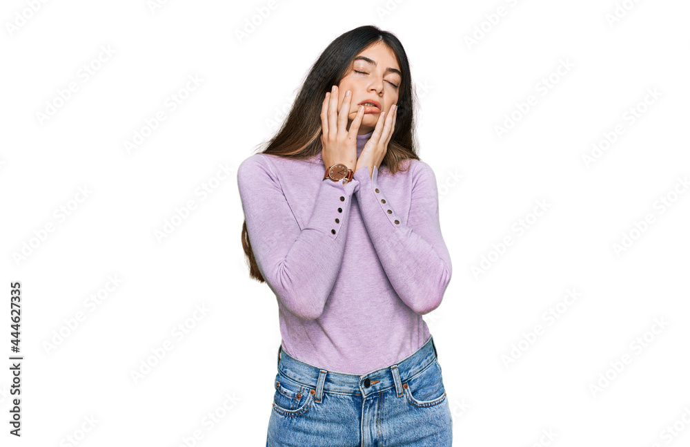 Young beautiful teen girl wearing turtleneck sweater tired hands covering face, depression and sadness, upset and irritated for problem Young beautiful teen girl wearing turtleneck sweater tired hands covering face, depression and sadness, upset and irritated for problem