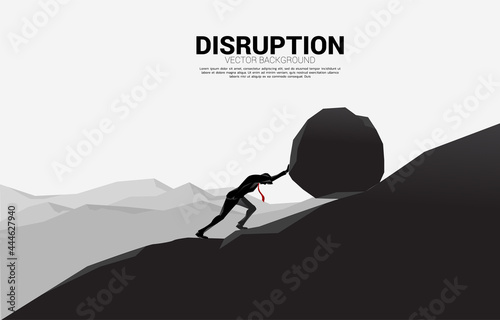 Obraz na płótnie Silhouette of businessman pushing the big rock to the top of mountain