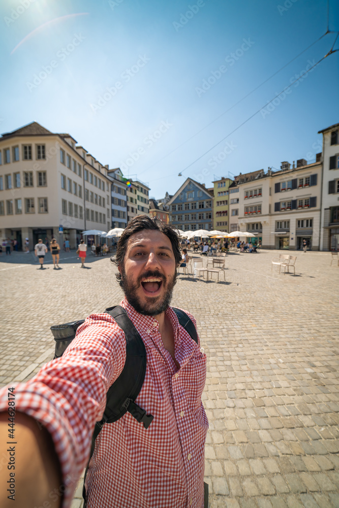 happy tourist man taking a selfie photo in Zurich, Switzerland
