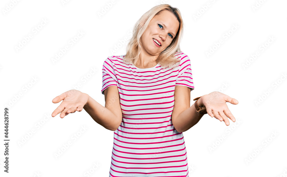 Young caucasian woman wearing casual clothes smiling cheerful offering hands giving assistance and acceptance. Young caucasian woman wearing casual clothes smiling cheerful offering hands giving assistance and acceptance.
