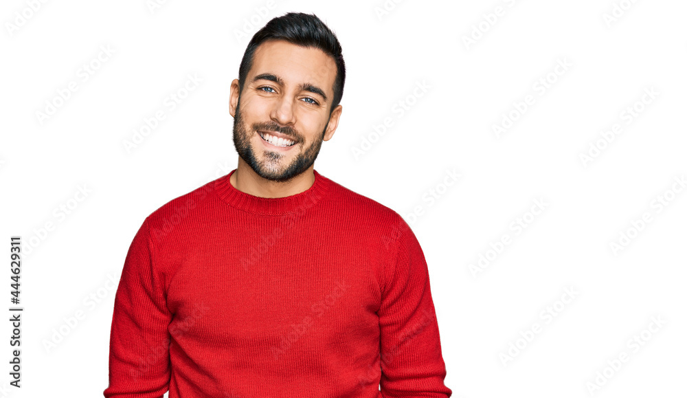 Young hispanic man wearing casual clothes with a happy and cool smile on face. lucky person.
