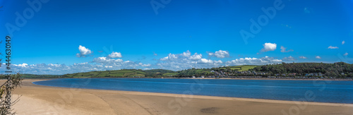 Panoramic shot of LLansteffan beach with clear blue water in southern Wales photo