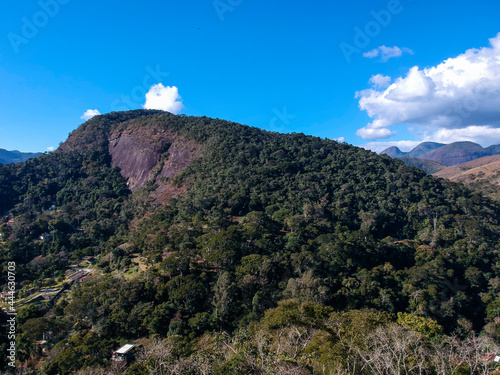 Aerial view of Itaipava, Petrópolis. Mountains with blue sky and some clouds around Petrópolis, mountainous region of Rio de Janeiro, Brazil. Drone photo. Sunny day. photo