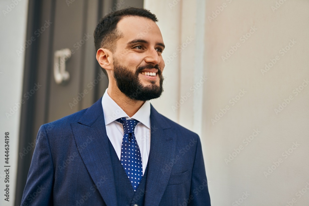 Young businessman smiling happy standing at the city. Young businessman smiling happy standing at the city.