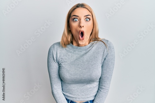 Young caucasian woman wearing casual clothes afraid and shocked with surprise expression, fear and excited face.